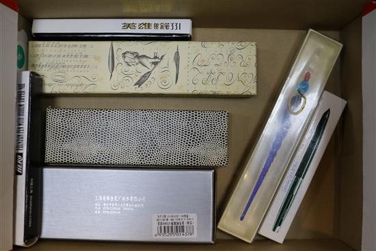 A collection of fountain pens and writing equipment
